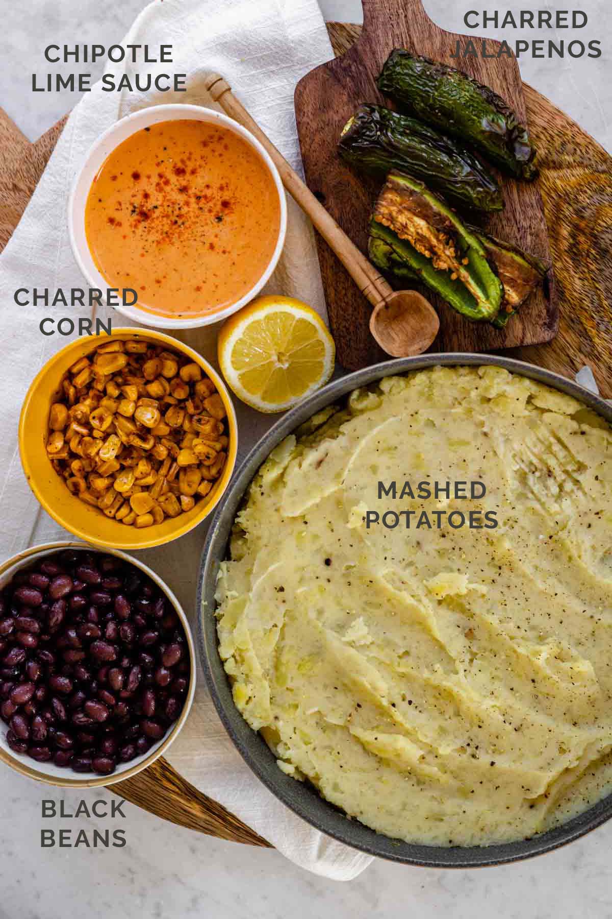 labeled ingredients for a loaded mashed potato bowl.