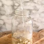 Cashews in a jar with a text title for Pinterest.