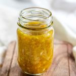 Yellow salad dressing in a jar with a text title for Pinterest.