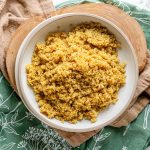 A bowl of cooked quinoa.