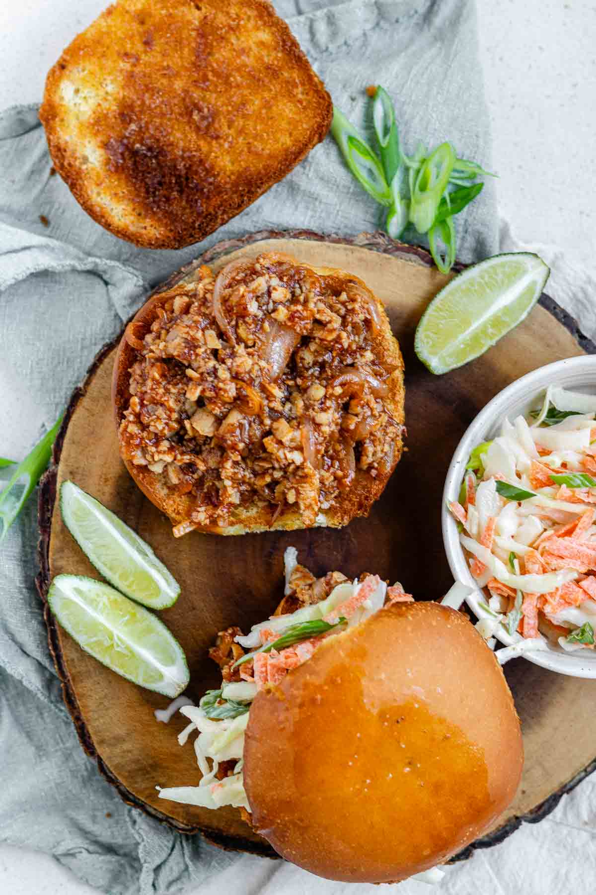 Toasted buns with tofu in barbecue sauce and cabbage salad.