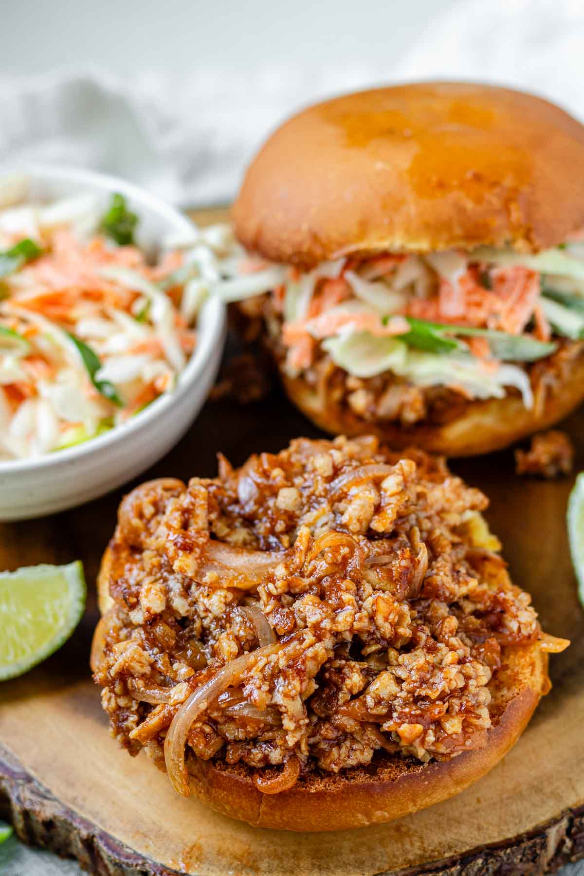 Toasted buns with tofu in barbecue sauce and cabbage salad.