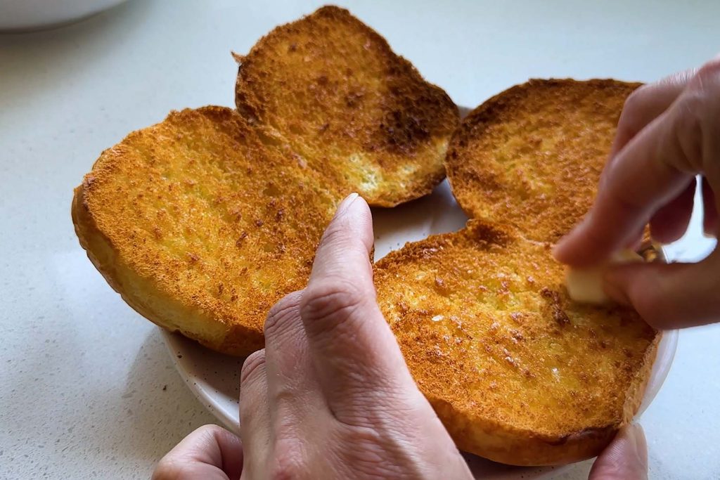 A garlic clove rubbed on a toasted bun.