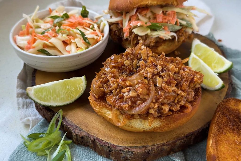 Toasted buns with tofu in barbecue sauce and cabbage salad.