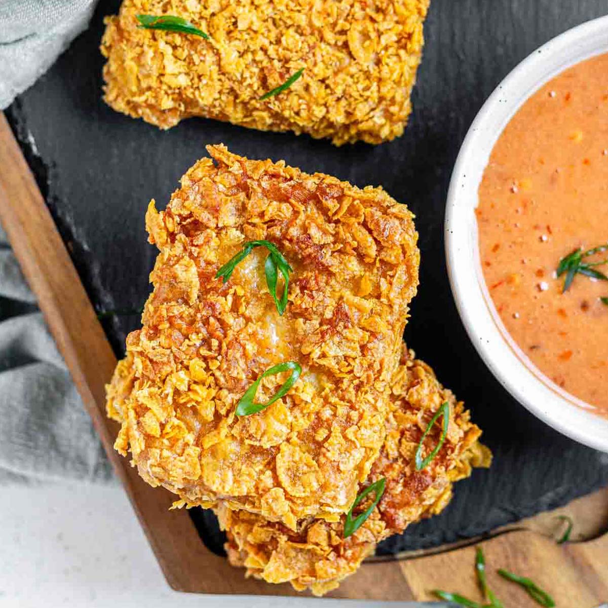 Crispy hot honey tofu coated in crushed cornflakes.
