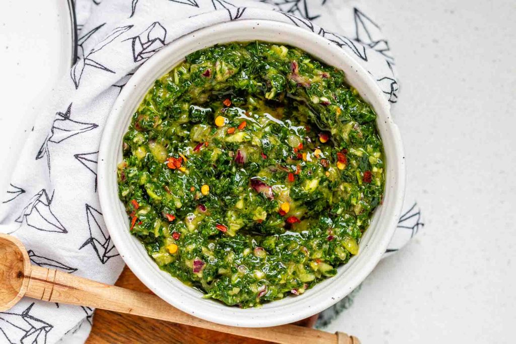 Green chunky sauce in a bowl.