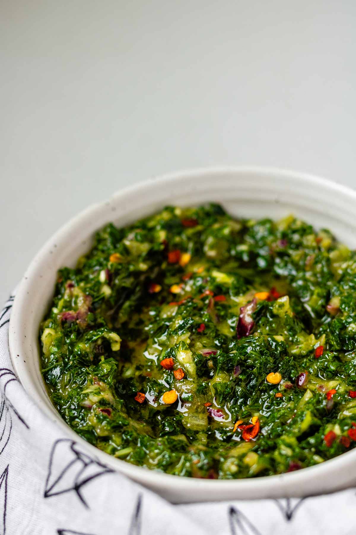 Green chunky sauce in a bowl.