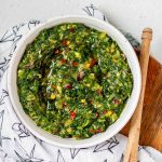 Green chunky sauce in a bowl with the text kale chimichurri.
