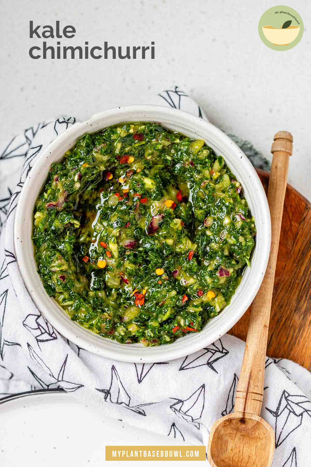 Green chunky sauce in a bowl with the text kale chimichurri.