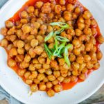 Chickpeas in red sauce in a bowl.