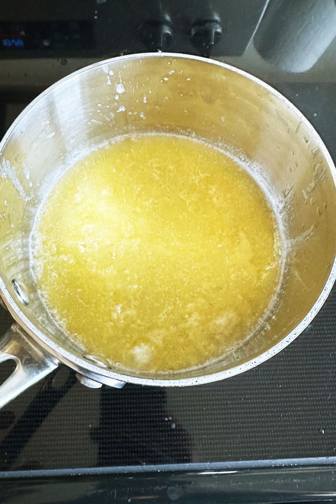 Melted butter in a saucepan.