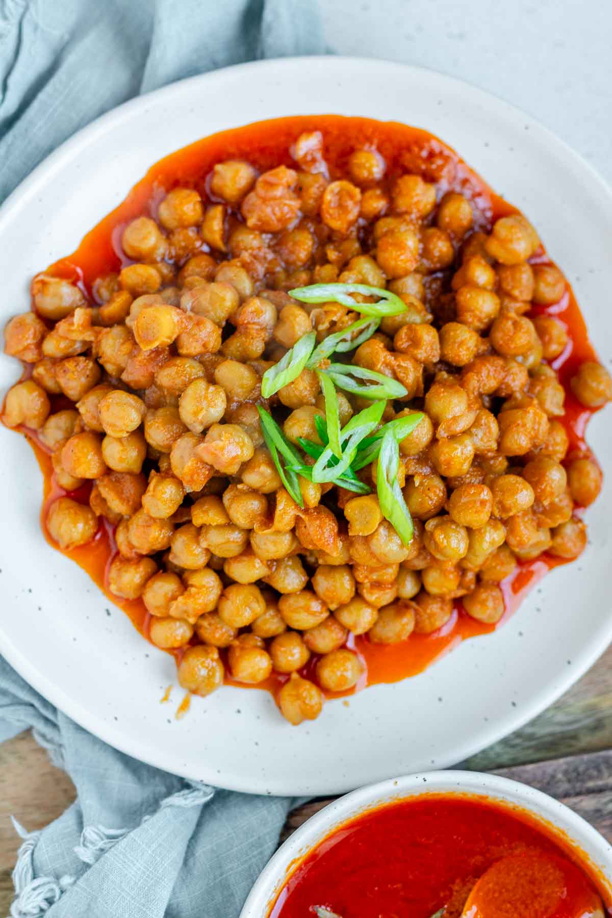 Chickpeas in red sauce in a bowl.