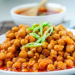 Chickpeas in red sauce in a bowl.