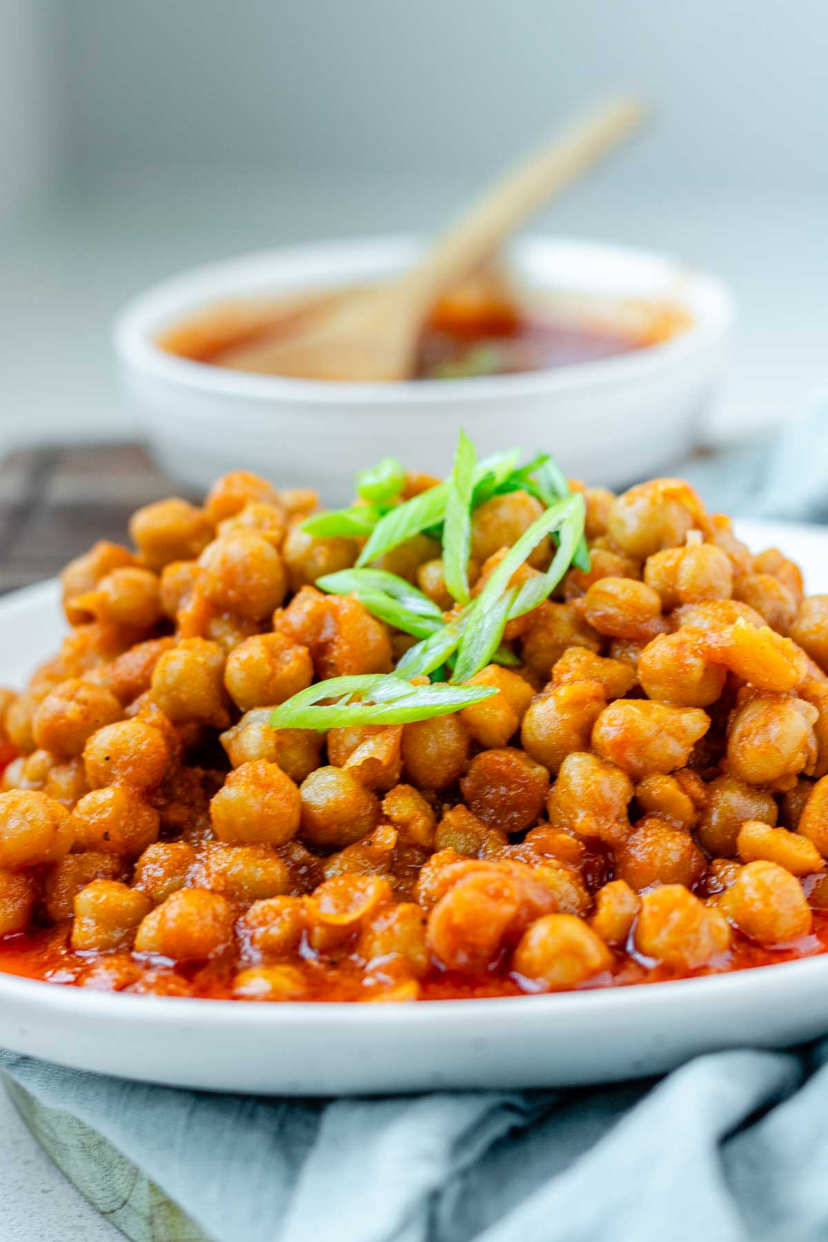 Chickpeas in red sauce in a bowl.