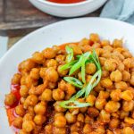 Chickpeas in red sauce in a bowl.