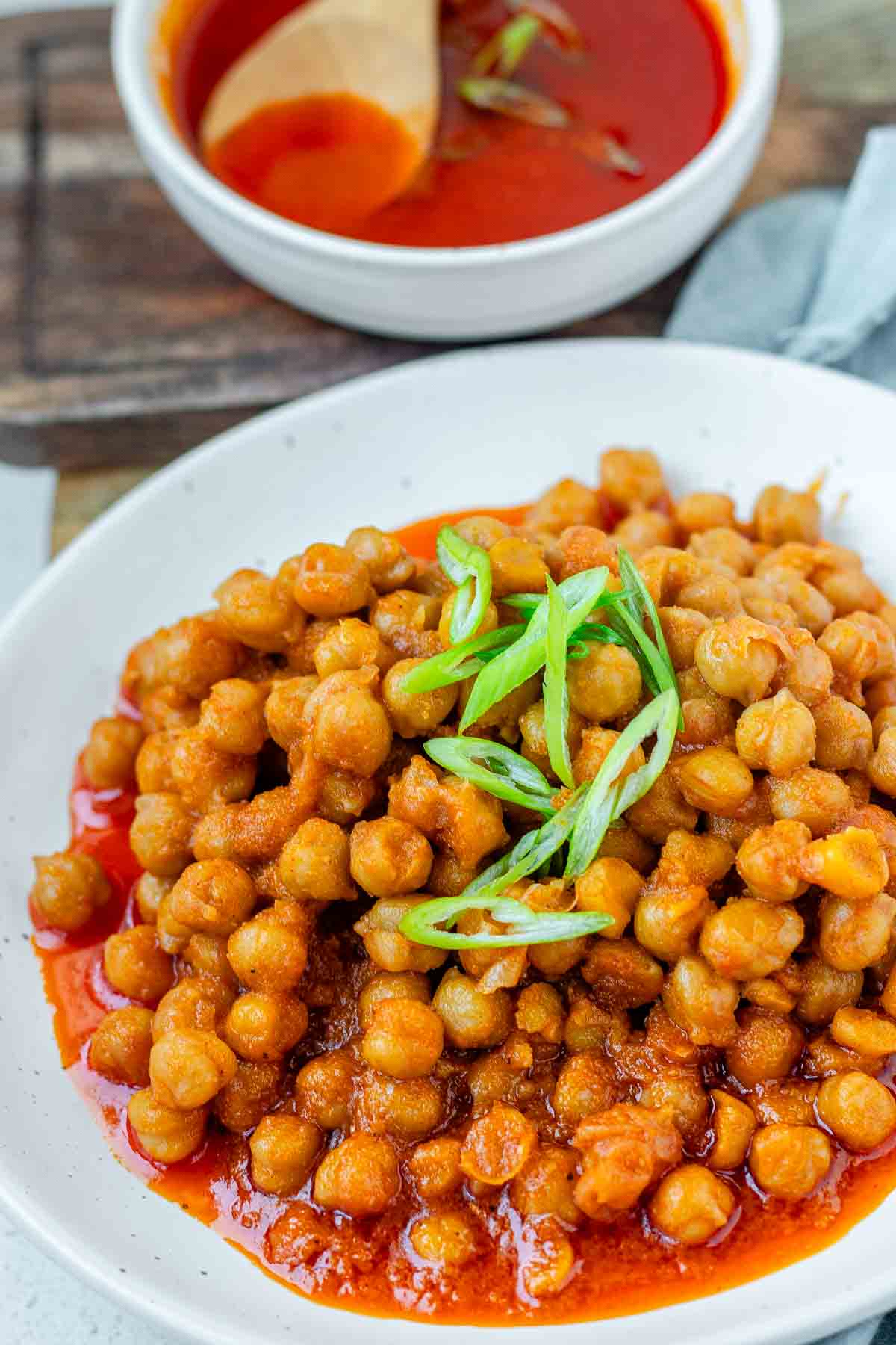 Chickpeas in red sauce in a bowl.