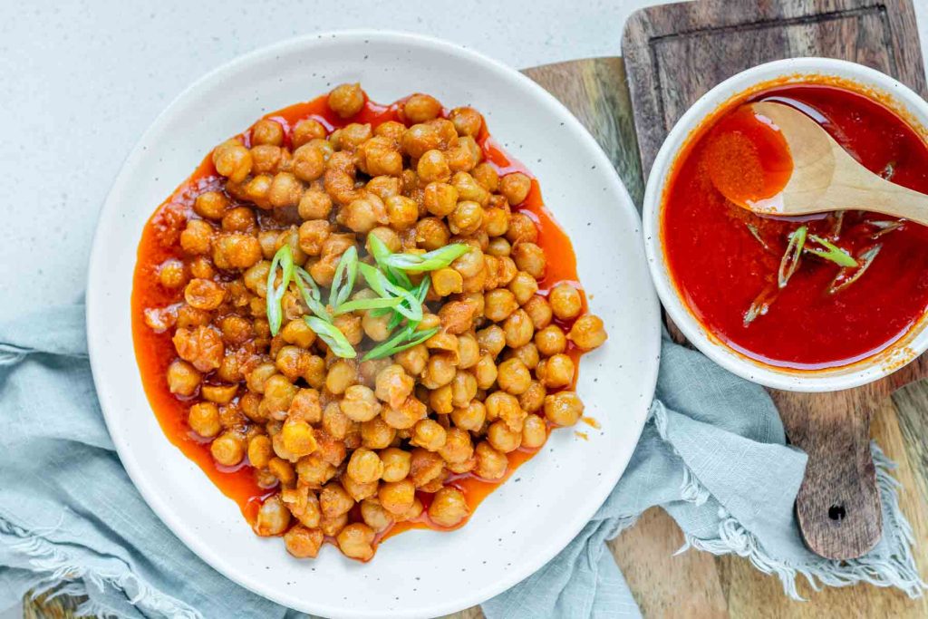 Chickpeas in red sauce in a bowl.