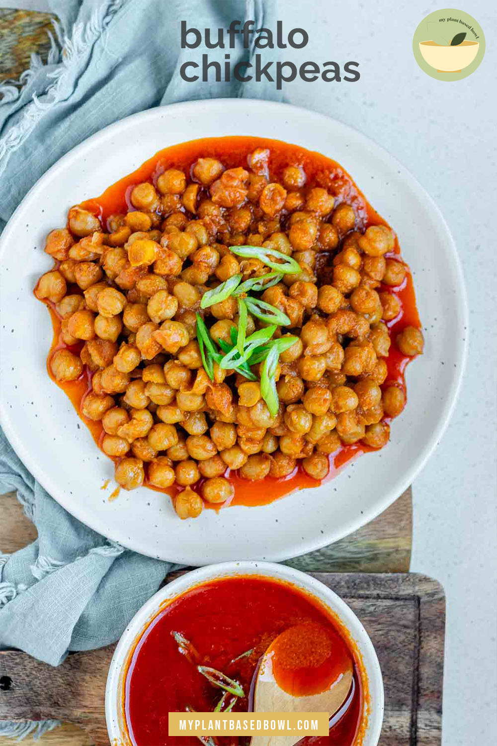 Chickpeas in red sauce in a bowl with the text buffalo chickpeas.