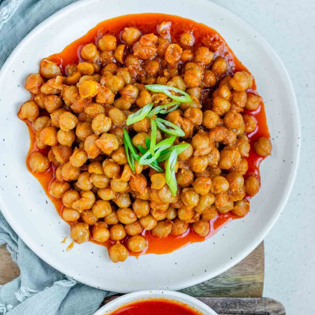 Chickpeas in red sauce in a bowl.