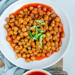 Chickpeas in red sauce in a bowl.