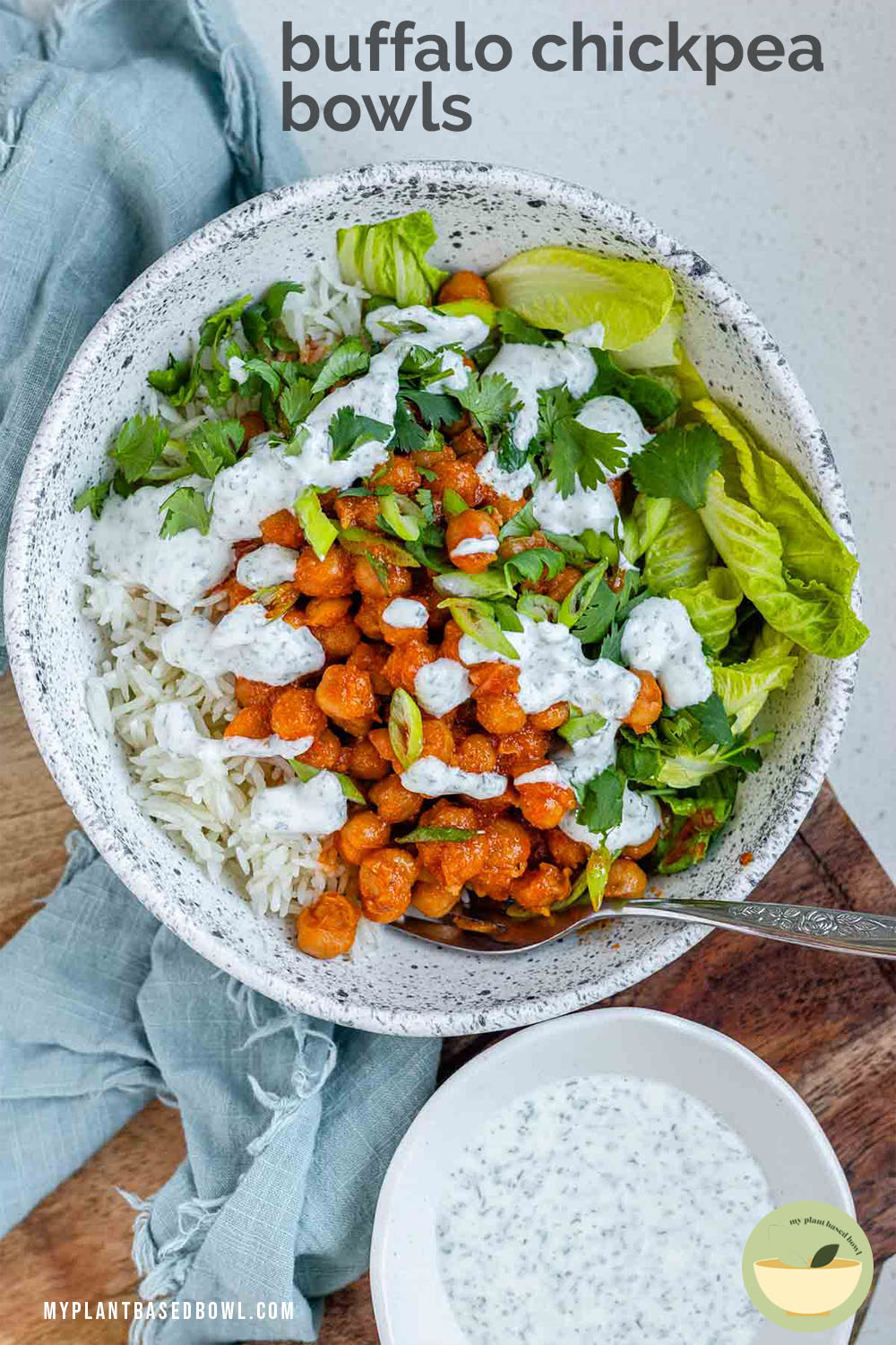 A bowl with rice, chickpeas, salad and a white sauce with the text buffalo chickpea bowls.